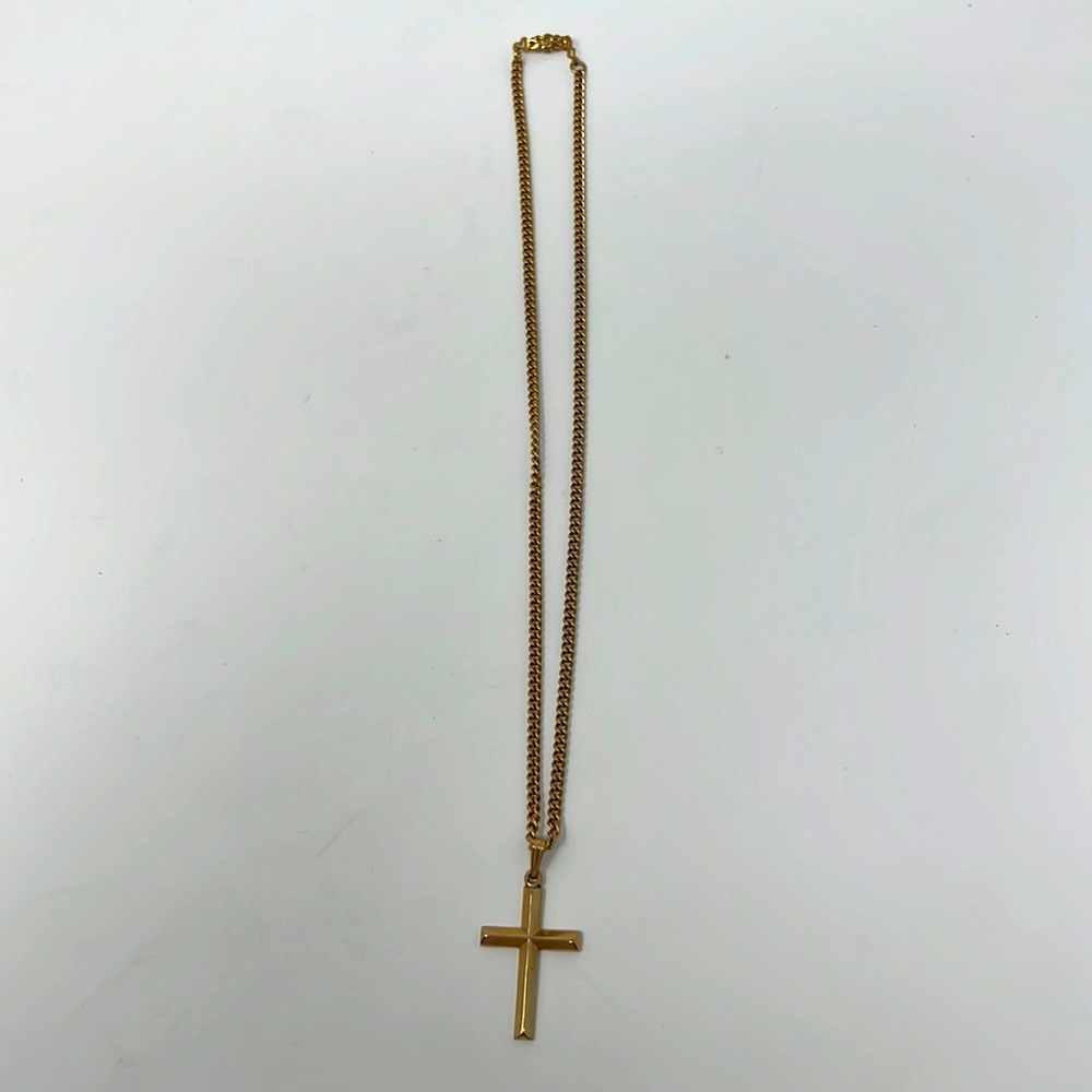 Golden necklace with cross